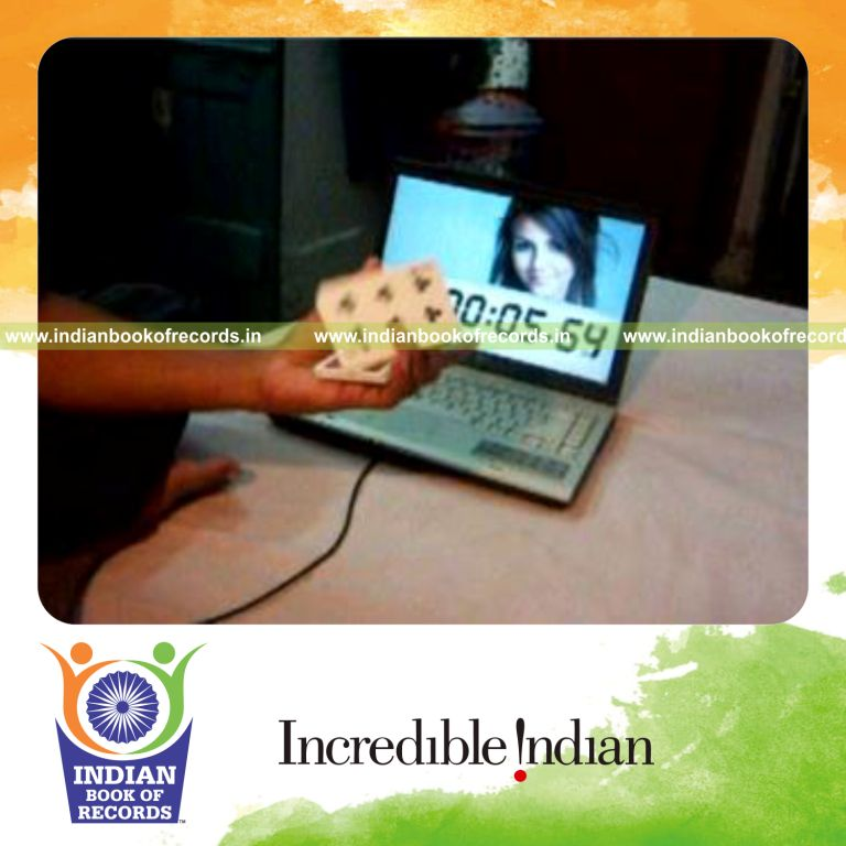 individual performing fastest k town flip card cut for record in Indian Book of Records