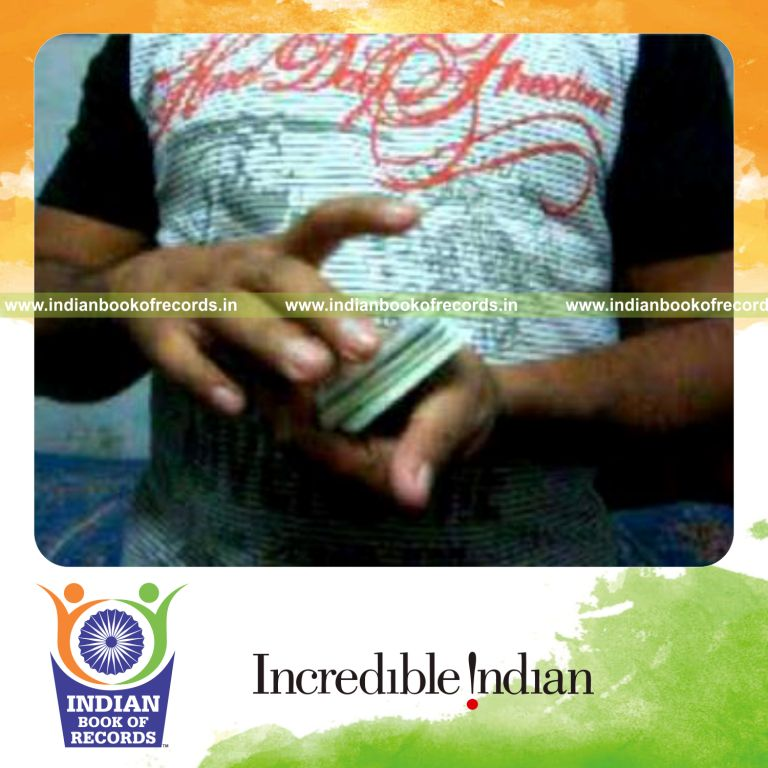 individual performing fastest keo kuts card flourish for record in Indian Book of Records