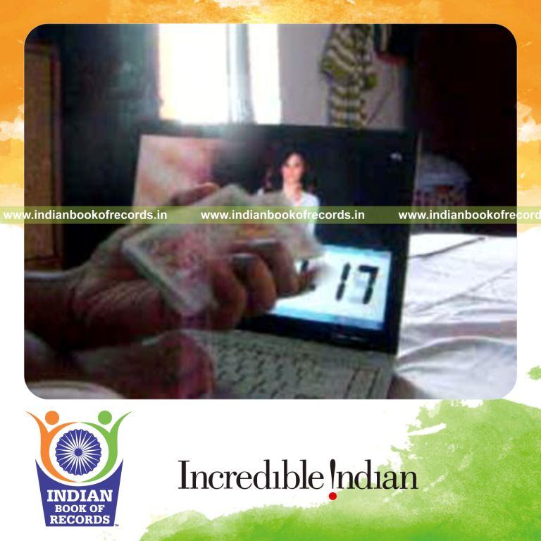 individual performing fastest knuckle card cut for record in Indian Book of Records