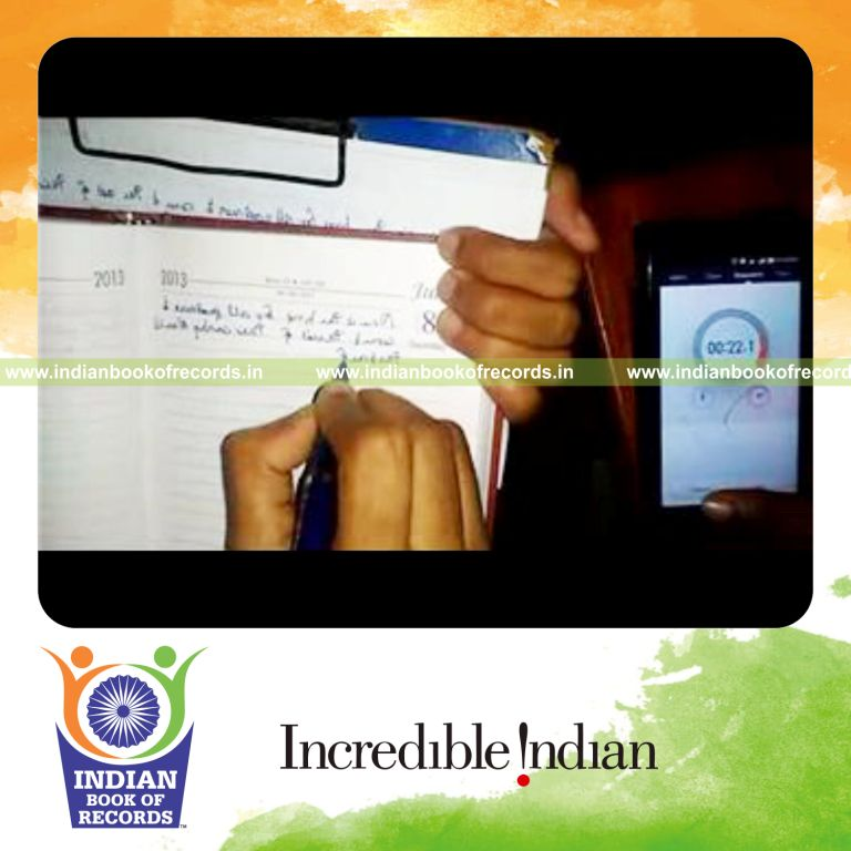 individual writing sentence in mirror writing with right hand twice for record in Indian Book of Records