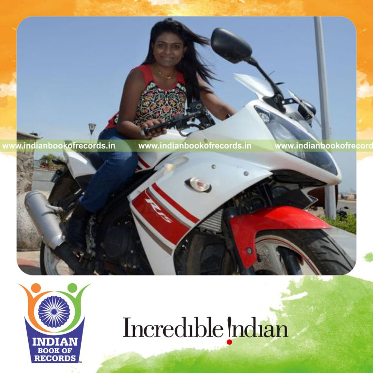 female individual riding motorcycle at high speed for record in Indian Book of Records