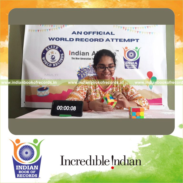 individual female solving multiplication problems while solving rubik cube simultaneously for Indian Book of Records