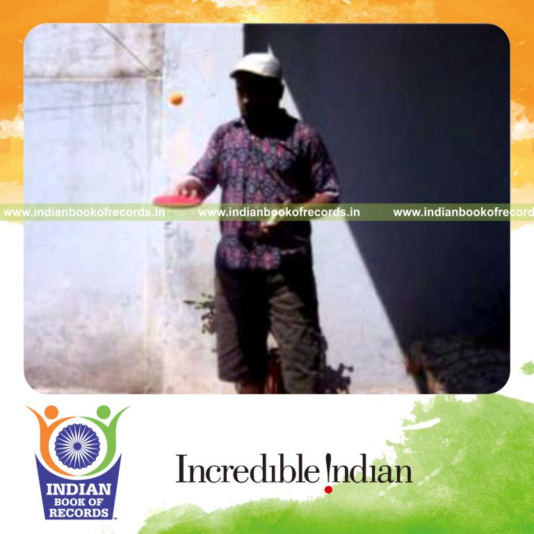 individual performing fastest muse card cut while bouncing ball for record in Indian Book of Records