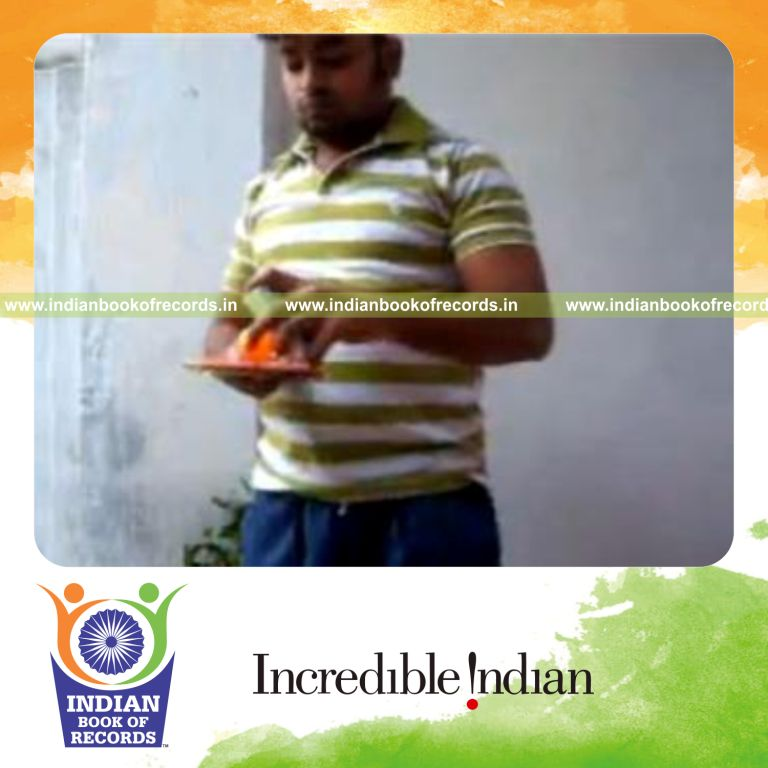 individual performing fastest one handed revolution 2 cut while bouncing ball for record in Indian Book of Records