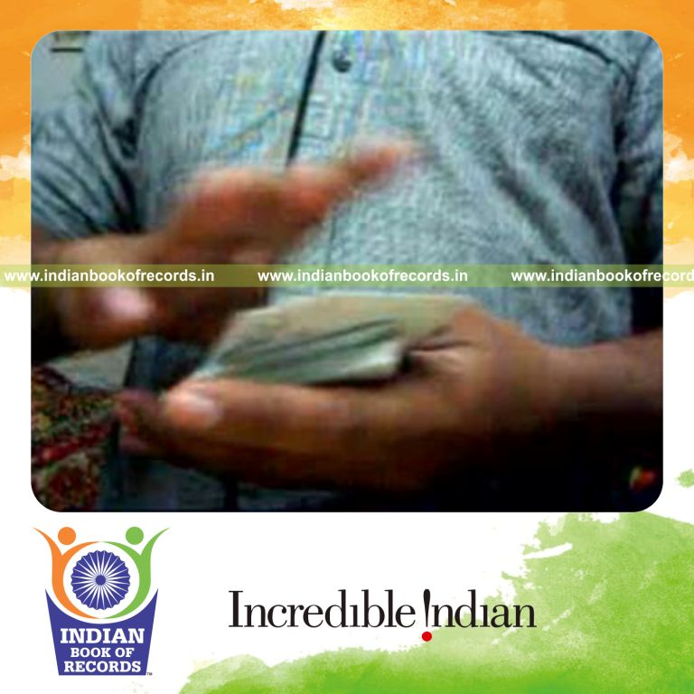 individual performing packet turnover with playing cards for record in Indian Book of Records