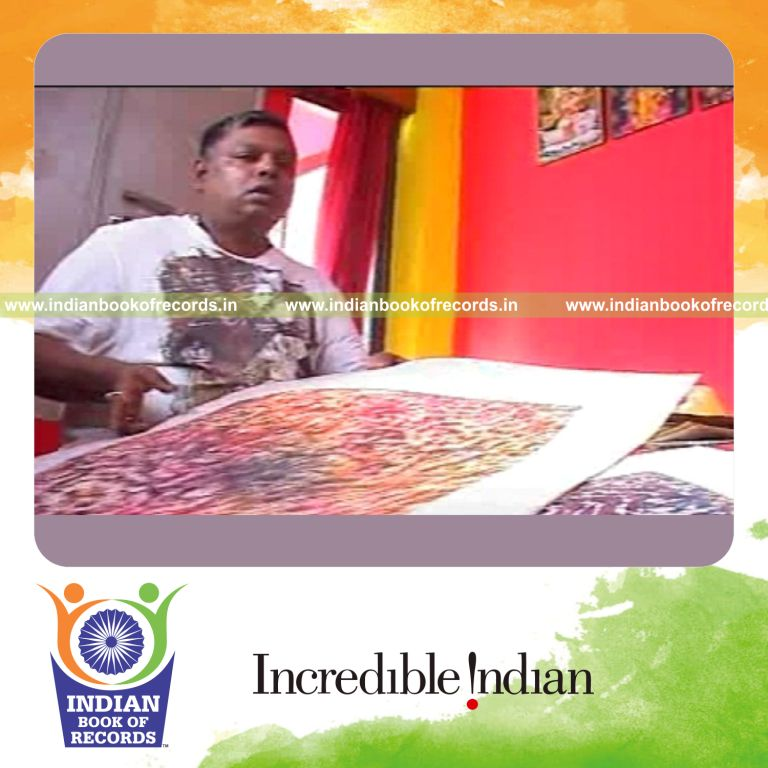 male artist completing painting quickly for record in Indian Book of Records