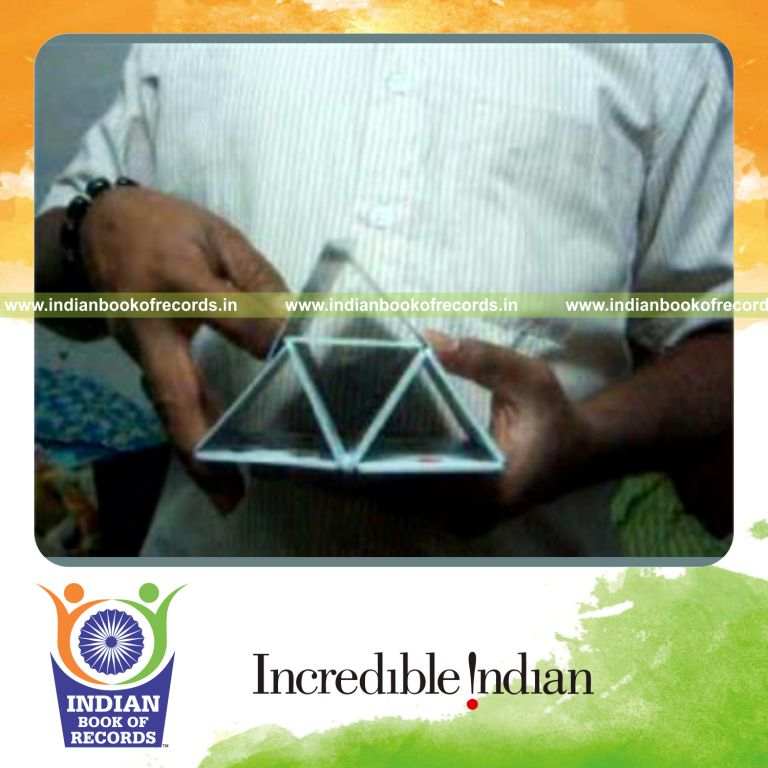 individual performing fastest pyramid card display in hand for record in Indian Book of Records