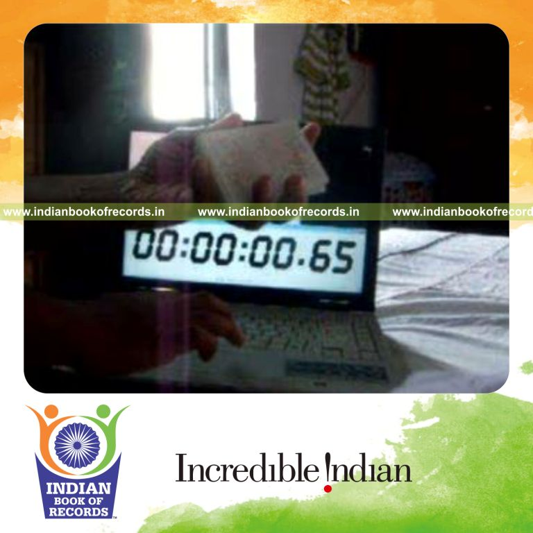 individual performing fastest reverse scissor card cut for record in Indian Book of Records