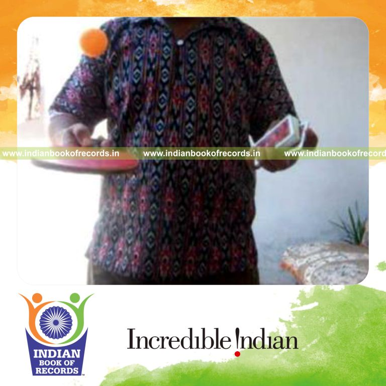 individual performing fastest reverse scissor card cut while bouncing ball for record in Indian Book of Records
