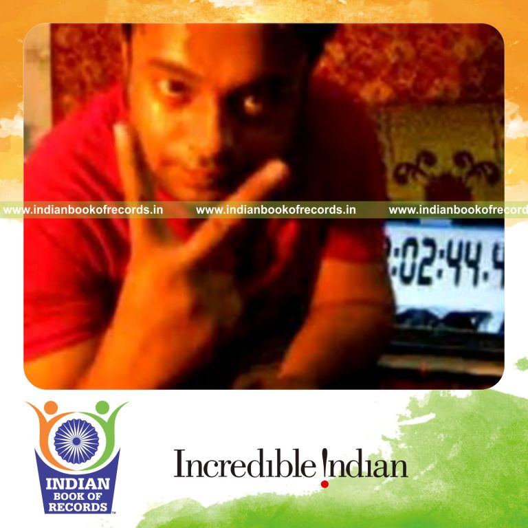 individual performing sabers rollback card cut while spinning toothbrush on pen for record in Indian Book of Records