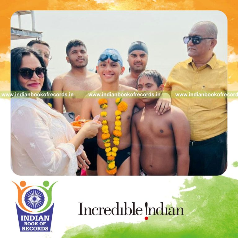 Physically challenged child swimming swiftly in the sea during a record attempt recognized by Indian Book of Records