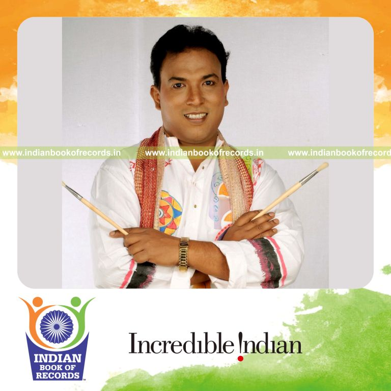 male individual sketching using numerals within three minutes for record in Indian Book of Records