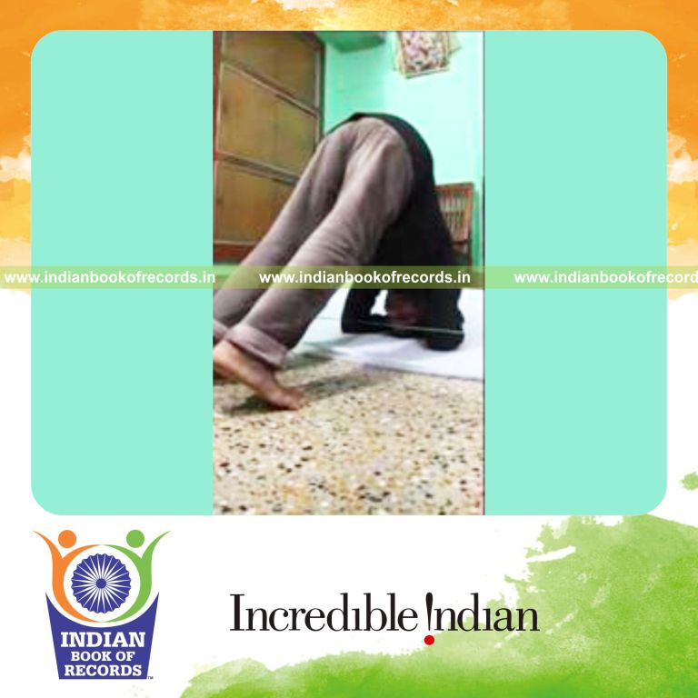 individual touching string with feet 100 times while holding headstand for record in Indian Book of Records