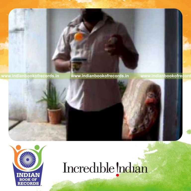 individual performing three packet card cut while bouncing ball on coffee mug for record in Indian Book of Records