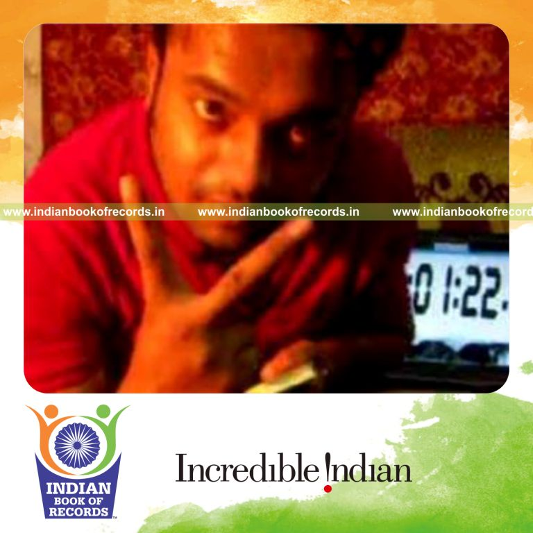 individual performing three packet thumb card cut while spinning toothbrush on pen for record in Indian Book of Records