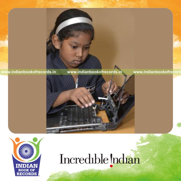 female individual dismantling and assembling laptop quickly for record in Indian Book of Records