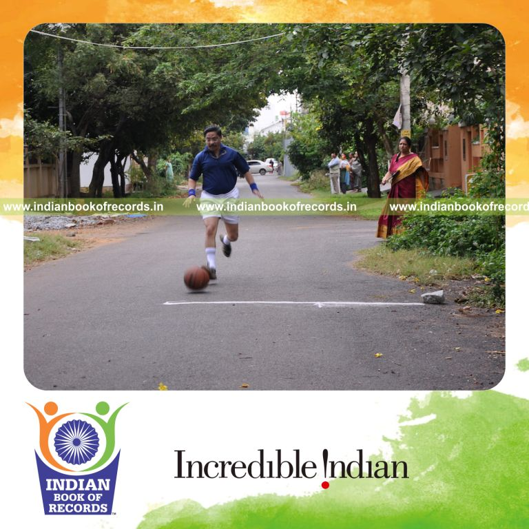 male individual running while dribbling basketball quickly for record in Indian Book of Records