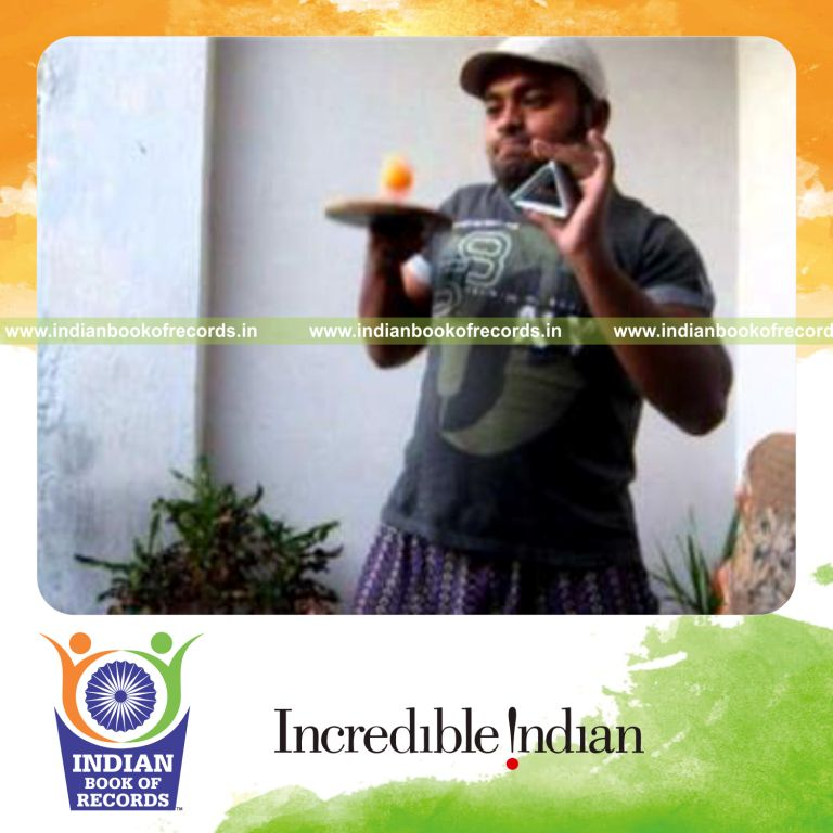 individual performing fastest triangle card display while bouncing ball for record in Indian Book of Records