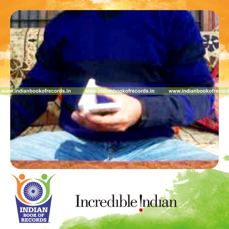 individual performing triple charlier and thumb card cuts quickly for record in Indian Book of Records