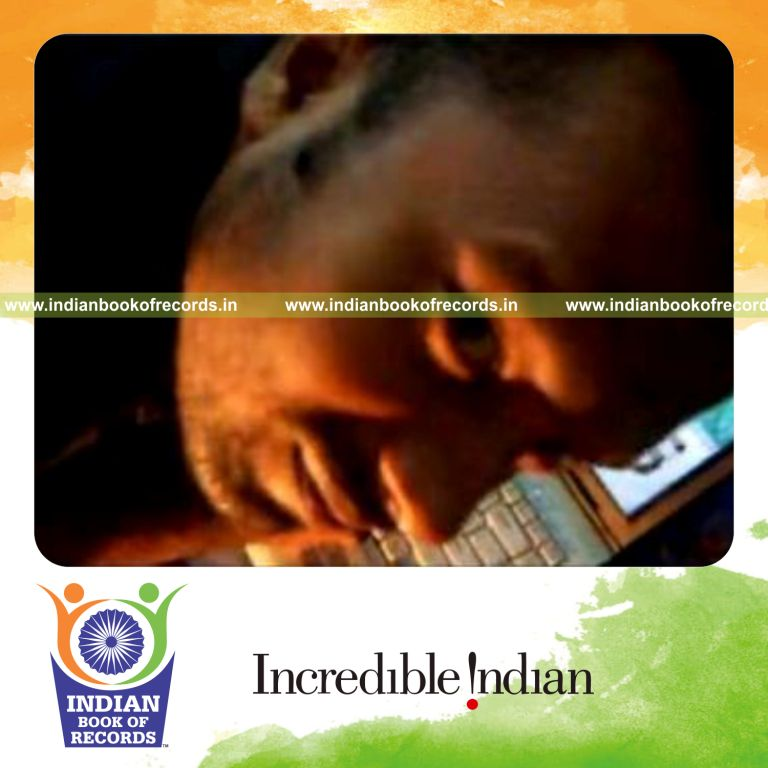 individual performing fastest triptych card displays in each hand for record in Indian Book of Records