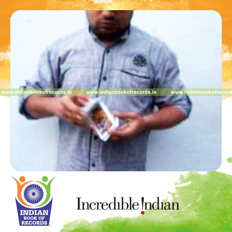 individual performing turnover card cut for record in Indian Book of Records