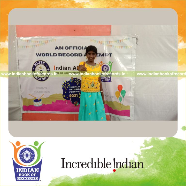 A participant rapidly solving 100 two-digit addition problems across three rows for the Indian Book of Records
