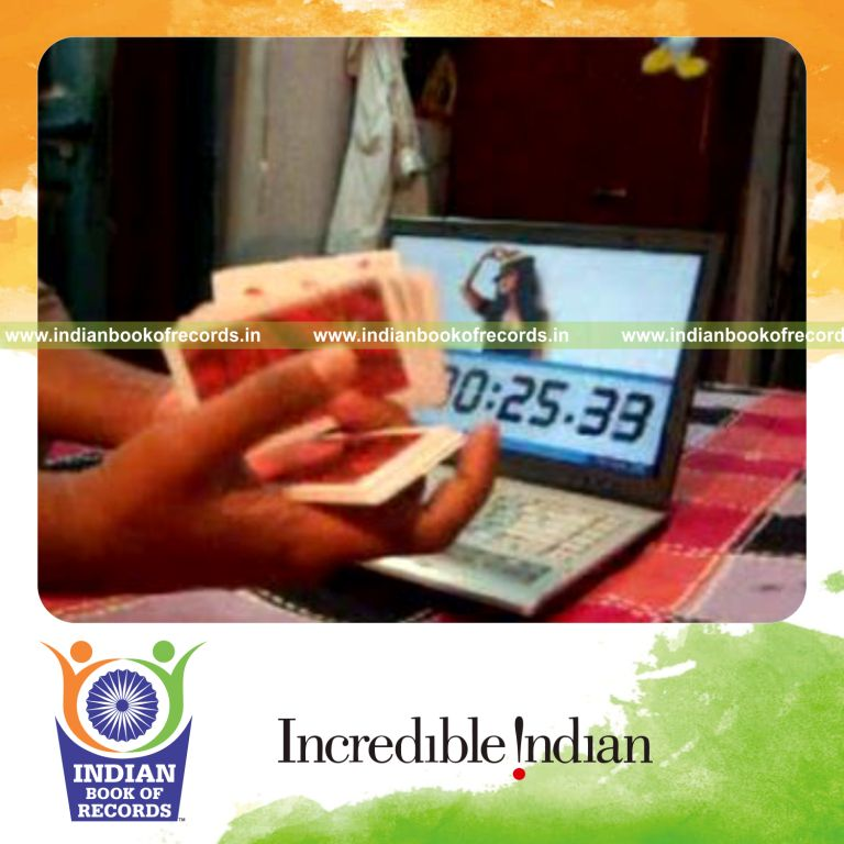 individual performing fastest two handed k town flip card cut for record in Indian Book of Records