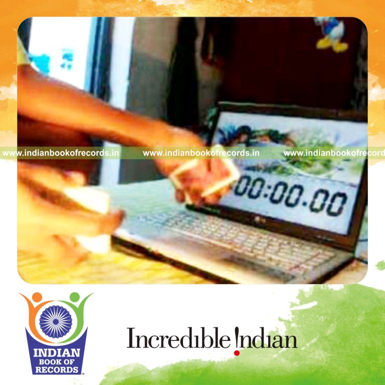 individual performing fastest two handed muse card cut for record in Indian Book of Records