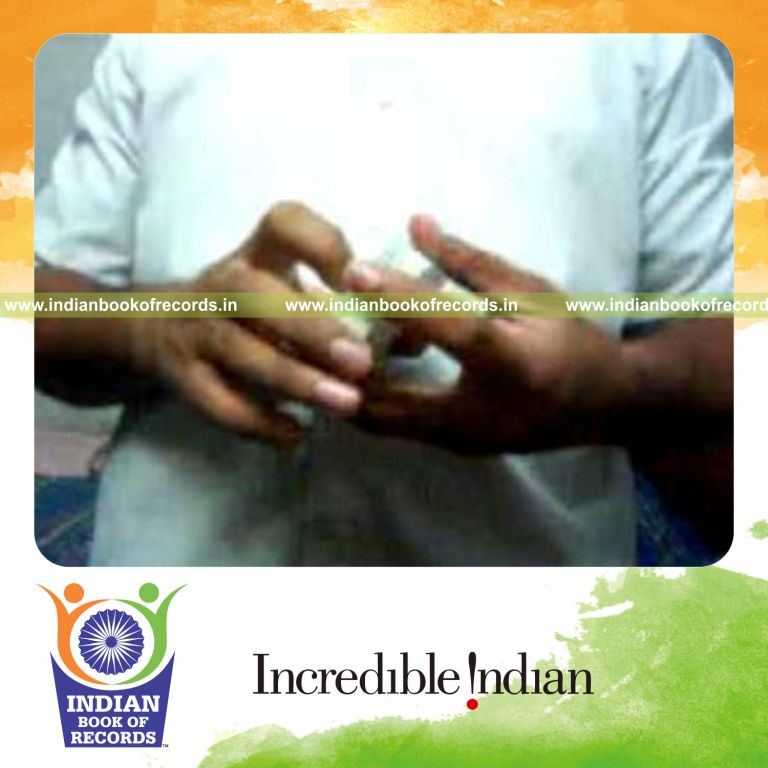 individual performing fastest two packet forward card rotation for record in Indian Book of Records