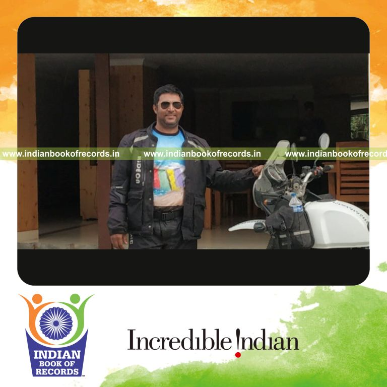 an individual completing a solo motorcycle parikrama journey around the narmada river for a record in Indian Book of Records