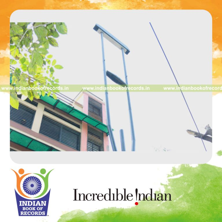 oversized crutch displayed as part of a unique record achievement for Indian Book of Records