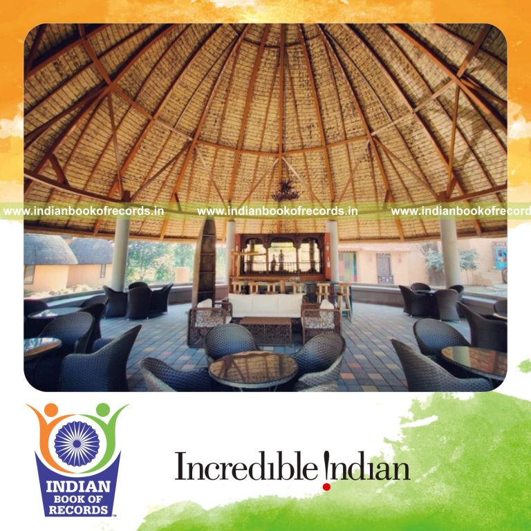 Tall dome structure made of grass installed at a resort recognized by Indian Book of Records