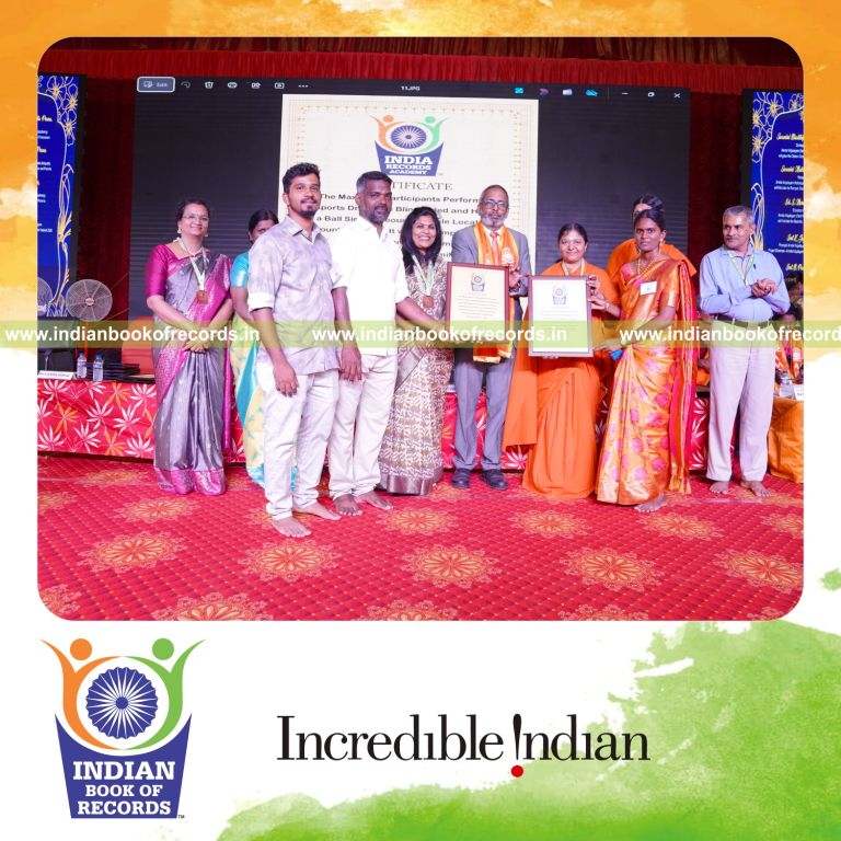 Crowd performing sports drills blindfolded while holding balls together at one venue for Indian Book of Records
