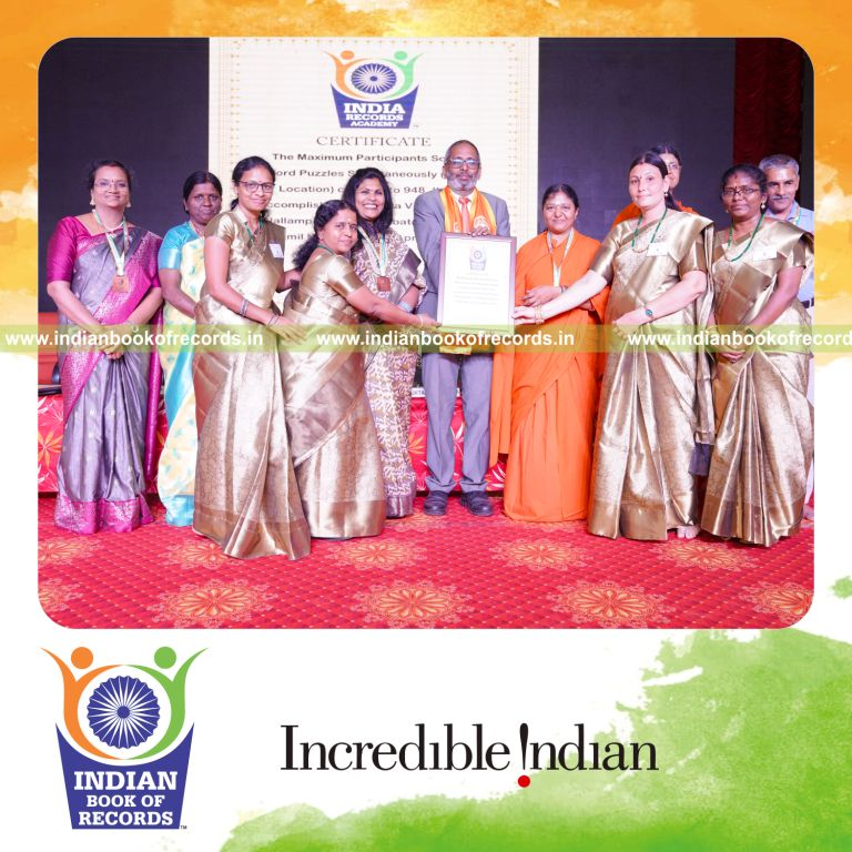 Large group engaged in solving word puzzles together at one venue for Indian Book of Records