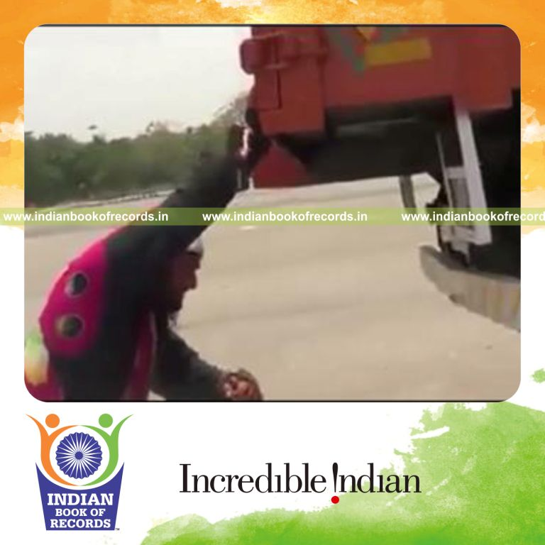 individual pushing heaviest truck 10 meters with one hand for record in Indian Book of Records