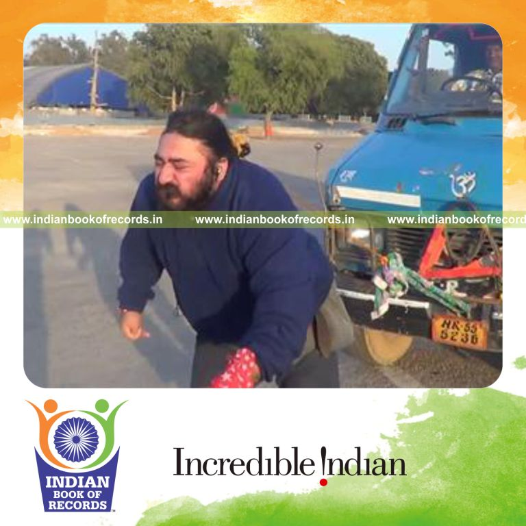 individual pulling heaviest vehicle using hair for record in Indian Book of Records