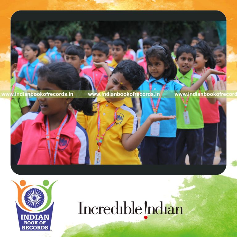 Participants performing the Hokey Pokey dance in large numbers at a single location for Indian Book of Records