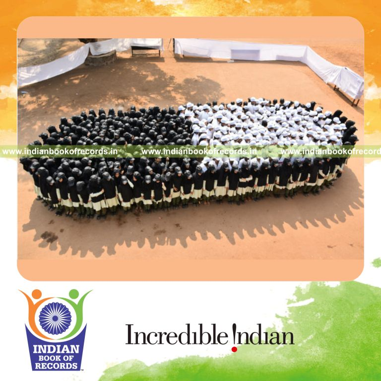 participants forming a human image of a medication capsule during a record event for Indian Book of Records