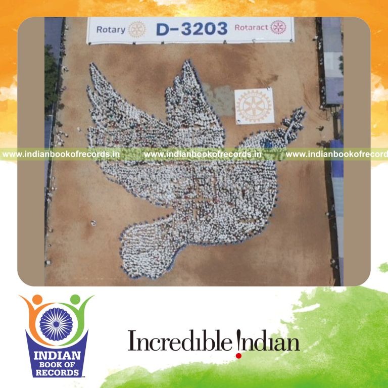 Large group forming a human image representing peace recognized by Indian Book of Records