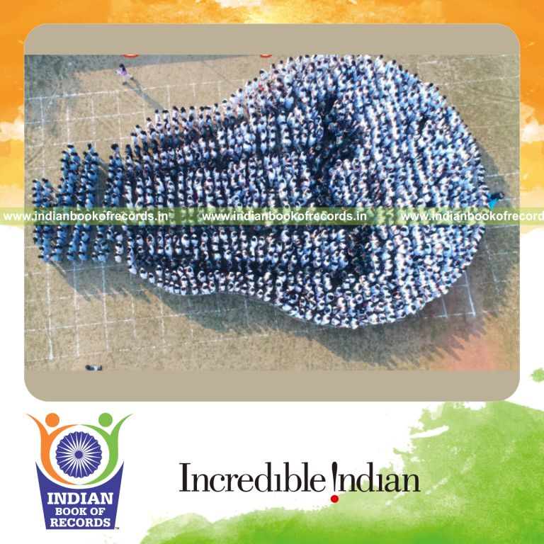 participants forming a human image of a light bulb during a coordinated record attempt for Indian Book of Records