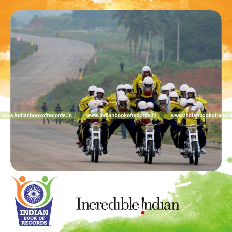 team forming human pyramid on moving bikes for Indian Book of Records