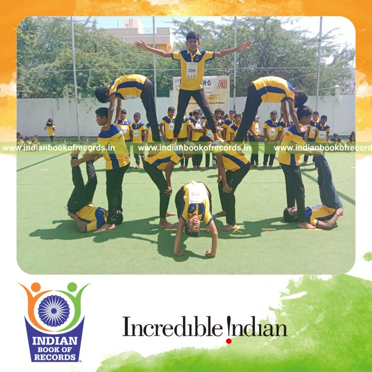 Team forming multiple human pyramids as part of a record-setting activity for the Indian Book of Records