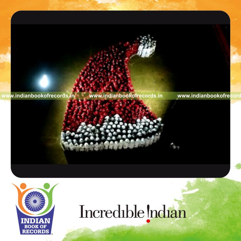 people forming a large human image of a santa hat as part of a festive record event for Indian Book of Records