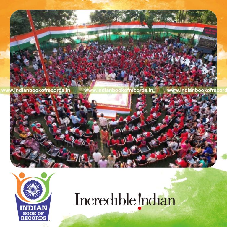 Couple performing large-scale kanya pujan and aarti ceremony with participants recognized by Indian Book of Records