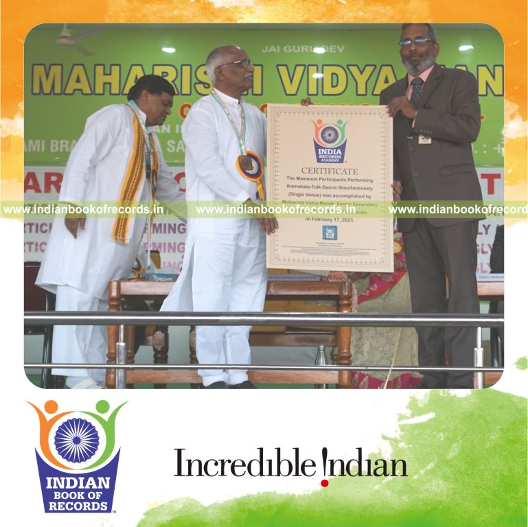 Large group performing traditional Karnataka folk dance simultaneously at one venue for Indian Book of Records