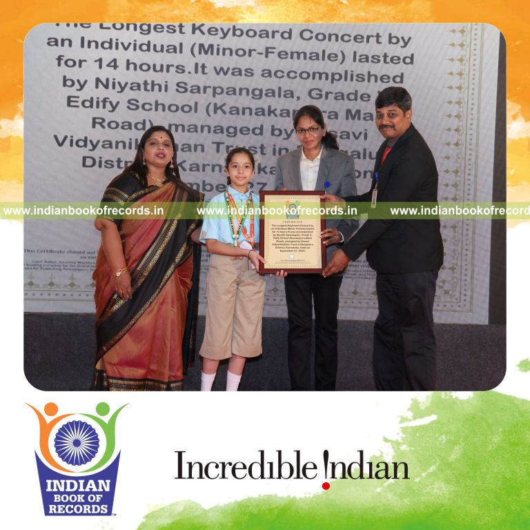 Young girl performing keyboard continuously during a long concert recognized by Indian Book of Records