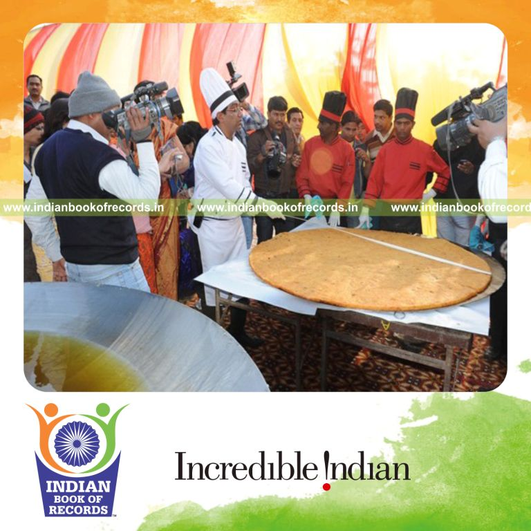 male individual preparing large aloo tikka for record in Indian Book of Records