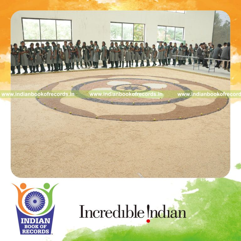 team creating large mosaic artwork using beans for record in Indian Book of Records