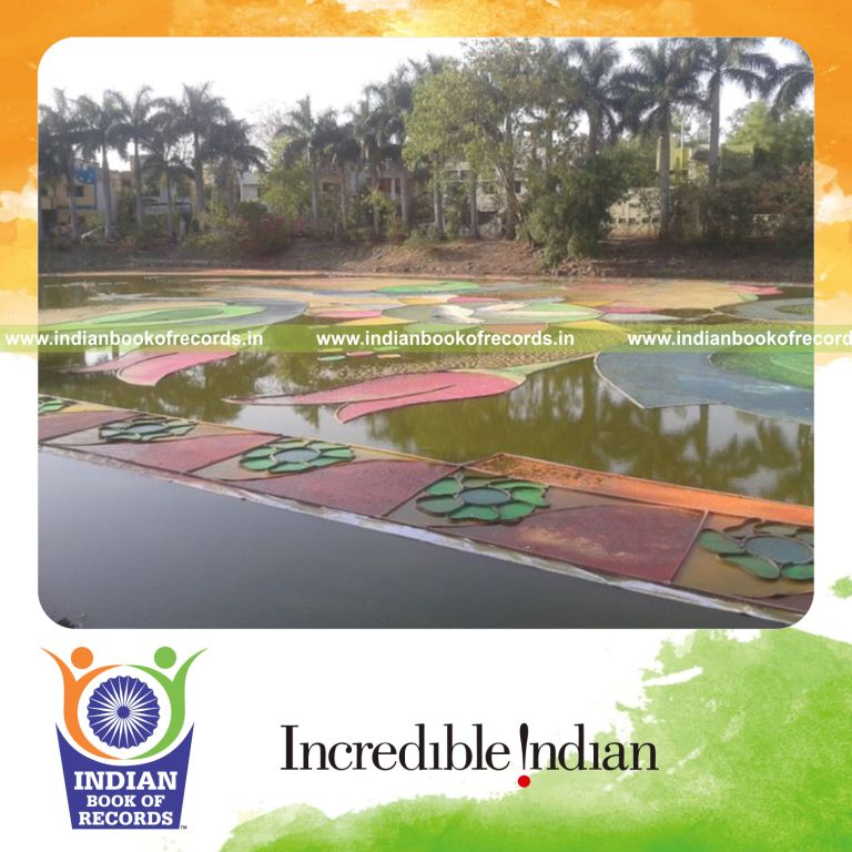 team creating large rangoli on water surface for record in Indian Book of Records