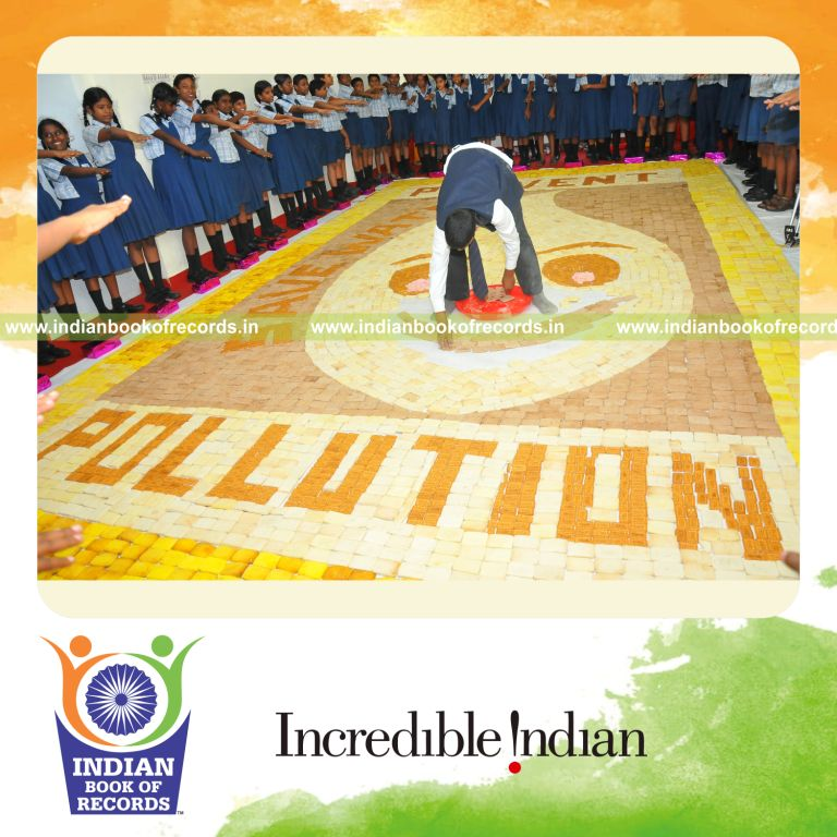 male individual creating large cookie mosaic artwork for record in Indian Book of Records